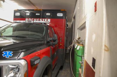 One fire truck is parked tightly in the garage.