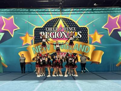 Old Rochester Youth Pee Wee pyramid: Flyers Corey Watlington, Caroline Sadek, and Izzy Waterman. 