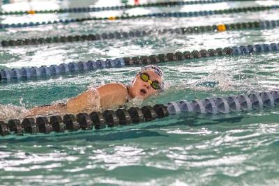 Elizabeth Chubb swims down a lane at the  Gleason Family YMCA during a Friday, Jan. 23 practice. Photos by Bobby Grady