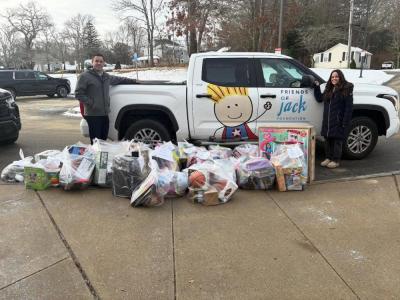 Board member Sam Philbrook, left, and Christina Tetrault, a guidance councilor at Sippican Elementary School, during a toy delivery to the school on Sunday Dec. 18, 2025. 