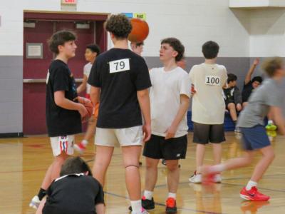 Sean Carvalho, right, talks with friends during tryouts. 