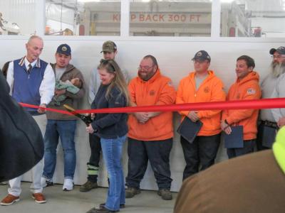 Rebecca Tilden, the recently-retired former DPW director, cut a ribbon to open the new building. 