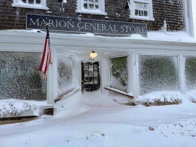 Strong gusts of wind blew snow onto buildings and covered windows, including at the Marion General Store. Photo source: Tucker Burr