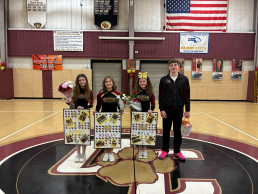 From left: cheerleaders Audrey Perkins, Ashley Marsalino and Kyla Troup, and basketball player Ryan Manchester pose together. 