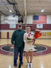 Sharon Delancey holds flowers and a gift basket she received  during the celebration. 