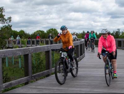 Cyclists smile for the camera at a past Tour de Creme ride. Photo source: Mattapoisett Land Trust