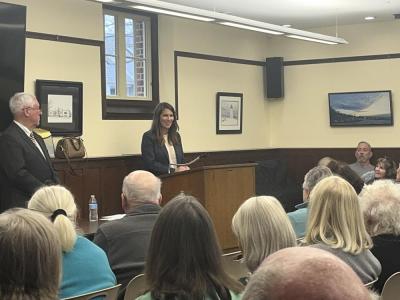 Select Board candidate Nicole Doyon Lynch addresses the crowd. 