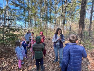 Piche talks to kids while on a walk. 