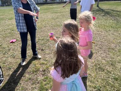 Kids play a relay game while learning about pollinators during a group meeting Wednesday, April 8.