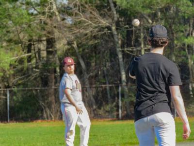 Mason Abreu, left, tosses a ball to his teammate. 