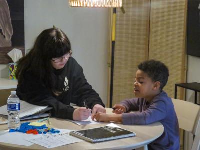 Sara Duane helps Emmerson with a worksheet during a peer tutoring session at the Learning Loft. Photos by Grace Roche