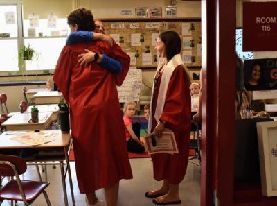 Senior Max Chace embraces his former teacher, Ashley Sweatland. Photos source: ORRHS
