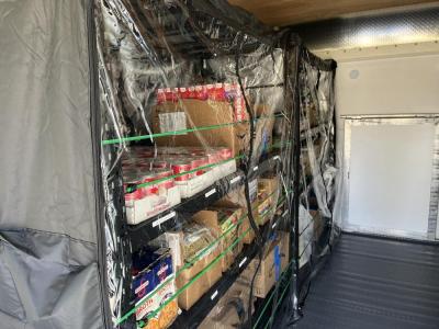 The pantry's shelves are full and ready for shopping. 