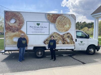 Maureen Vieira, left, and Nora DuPont stand beside the mobile food pantry at the Rochester Council on Aging. Photos by Grace Roche