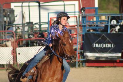 A rider rounds the barrels. Photos by Brandy Muz