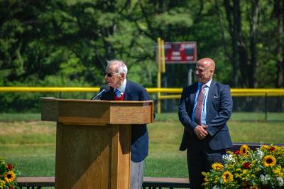 Former Superintendent John Oliveira, left, speaks while current Superintendent Aaron Polansky looks on. 