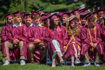 Graduates listen to the commencement speeches. 