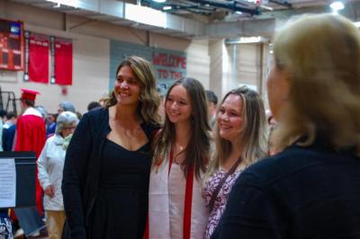 A graduate poses for a photo. 