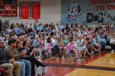 Community members packed the gym for the indoor ceremony. 