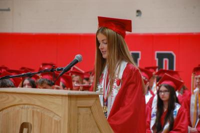 Class President Caroline Houdelette speaks to the crowd and her classmates. 