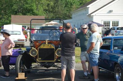 Visitors admire a Model T from 1914 at the Rochester Center on Aging on Thursday, June 11. Photos by Grace Roche