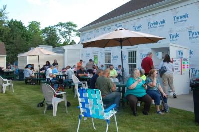Visitors sat on the lawn and enjoyed refreshments during the car show. 