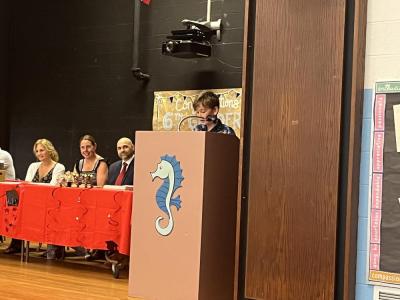 Old Hammondtown Elementary School student Micah Kratochvil gives a speech at his school's sixth grade graduation. 