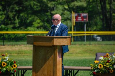 Gary Linehan, principal of Old Colony Regional Vocational Technical High School, speaks at a graduation. Photo by Grace Roche