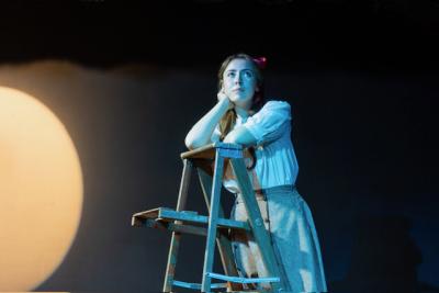 Emily gazes at the night sky after a conversation with George. 
