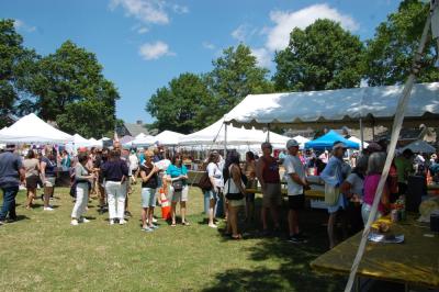 The Lions Club served food under the big white tent in the park. 
