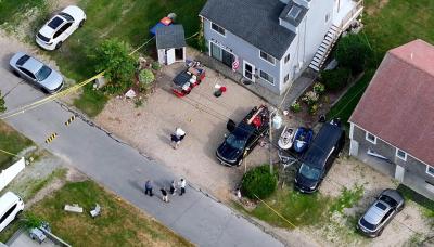 Officials investigate 10 Harbor Road, where the shooting occurred on June 30. Photo by David Curran