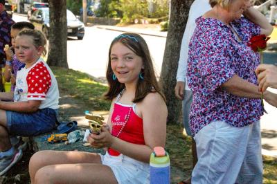 Zola Campbell, 11, holds the trophy her family won for their decorated convertible. 