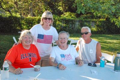 From left: Karen Gray, Tracy Djerf, Roxanne Burget and Drew Nahigyan, all of Mattapoisett, pose together at the community picnic. 