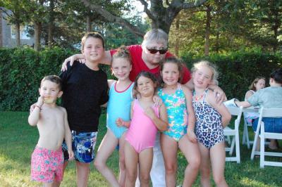 From left: Oz Lehner, 4, Colin Curtis, 9, Dakota Nahigyan, 8, Nola Nahigyan, 4, Mina Lehner, 7, and Vera Lehner, 7 smile with organizer Barbara Gaspar. 