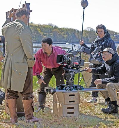 Tyson Brown as Paul Cuffe films a scene for the upcoming film "Cuffe: Untaxed" on the bank of the Slocums River.