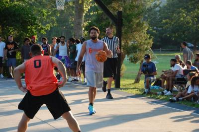 Dame Perry takes the ball up court. 