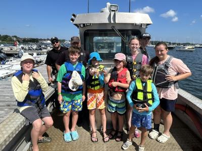 Coastal explorers take a trip on the Marion Harbormaster boat during the week-long program. Photos source: Marion Natural History Museum