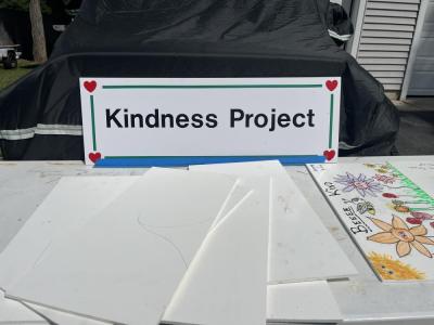 A table on Stan Bradford's property offers boards for people to decorate and return for his Kindness Project. Photos by Grace Roche