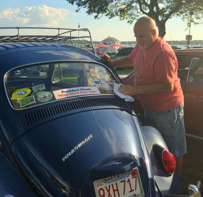 David Despres wipes his car clean at the car show. He's been coming to the shows for serveral years with his 1967 Volkswagen Beetle, who he calls Jerry.