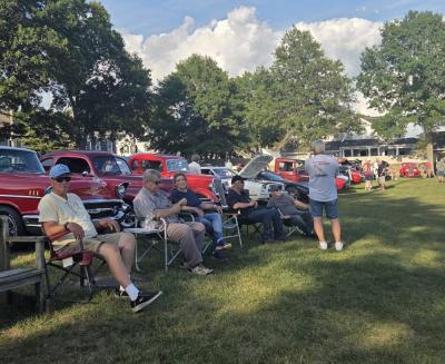 Many folks sat at the park in lawn chairs, listening to music and surrounded by vintage cars.