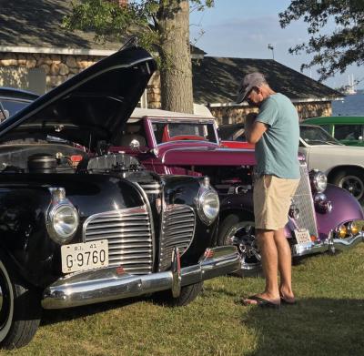 Many cars had their hoods up and windows down so people could get a closer look.