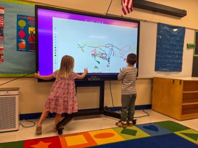 Students play in the Project GROW room, the school's preschool program. 