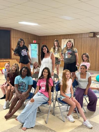 Gioioso and her students pose together. 