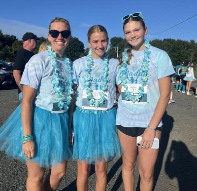 From left: Erin Norton, Cameron Norton and Cali Mills. “We’re here to run for Maddie Eitas, who we’ve known for a very long time,” Erin said. “She’s been very special to us, and we’re here to honor her memory.”