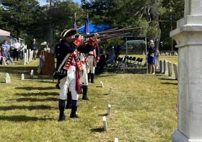 The Henry Knox Color Guard and RTP Living History Color Guard performed a three-musket volley salute. They raised and fired their arms three times.