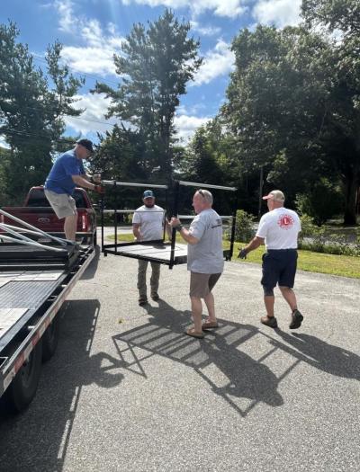 Mattapoisett Lions Club members unload part of a ramp they installed for a Marion family Saturday, Sept. 5. Photos source: Mattapoisett Lions Club