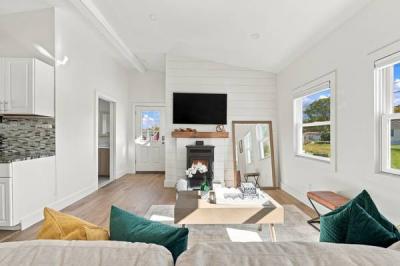Pellet stove on a shiplap wall in the living room of 226 Sanford Road, Westport, MA