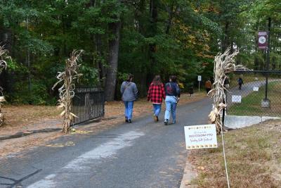 A group walking through the gates to Old Colony’s football field, where the event took place.