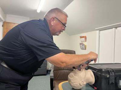 EMS Officer Philip Tura demonstrates how the new video laryngoscopes work. 