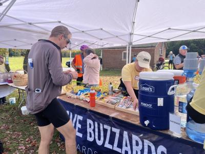 A rider grabs supplies. 